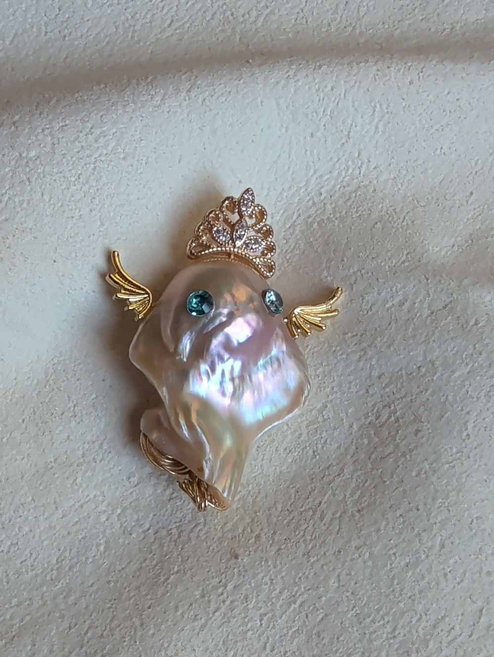 Iridescent Pearl Pendant with Gold Accents and Blue Crystals